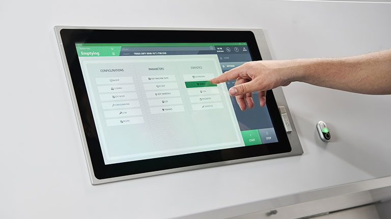 Operator using a Cimbria SEA.IQ PLUS HMI control panel